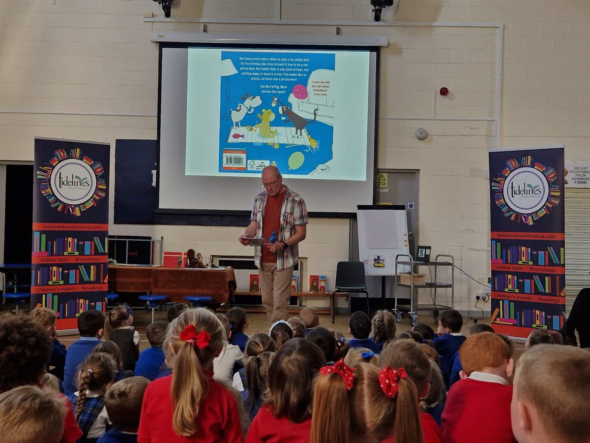 TidelinesFest's tweet photo. Today we took author @AlanDapre to the fabulous Ardeer Primary for the 3rd of our 10 school visits and left them some copies of Grizzly Ben for the school, handed over by volunteer &amp; hard working Tidelines Secretary Julie. Thank you to Specsavers Irvine &amp; @CunninghameHA 📚❤️ https://t.co/Qb5BEmwJgu