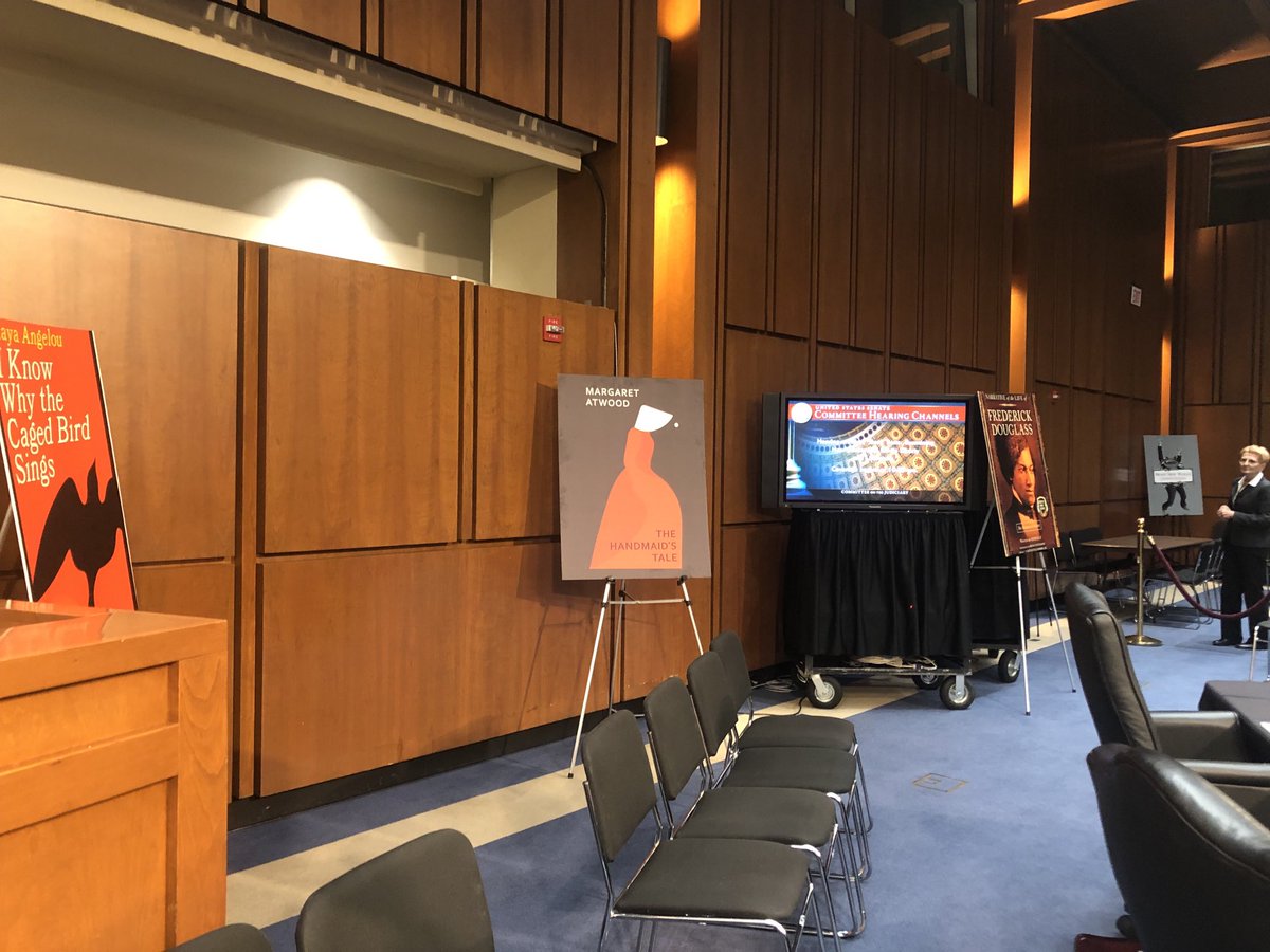lynnsweet's tweet photo. I am covering  this morning - @SenatorDurbin Judiciary Committee Hearing on Book Bans. Illinois Secretary of State Giannoulias to testify on Illinois first-in-the-nation ban on book bans. Hearing room features covers of books banned through the years. https://t.co/WyFLMVKhaO