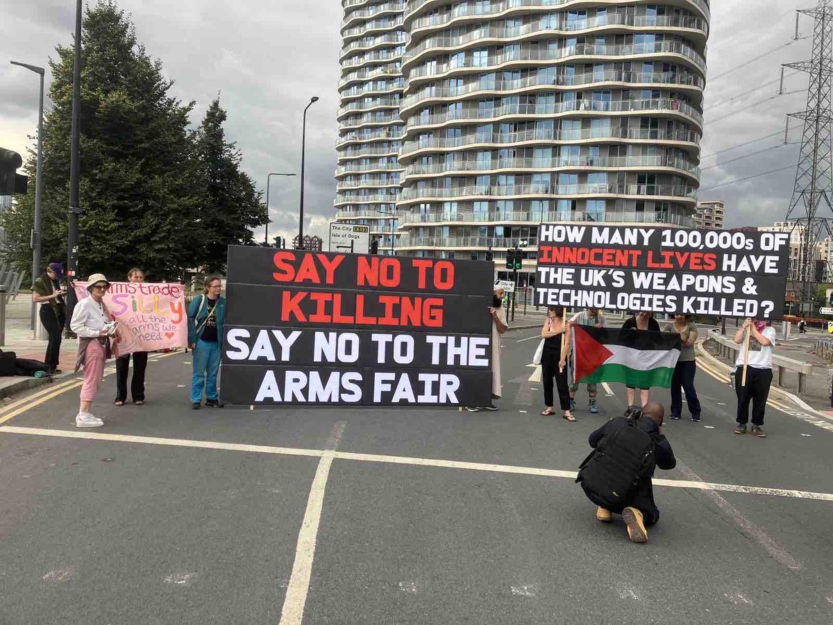 Just now: Campaigners blocking the road in East London outside the DSEI arms fair #StopDSEI