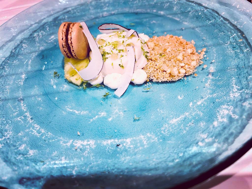Pina colada - coconut panna cotta, rum cream, sous vide pineapple, yuzu gel, white chocolate amaretti crumb, dark chocolate spiced rum macaron, lime, coconut.