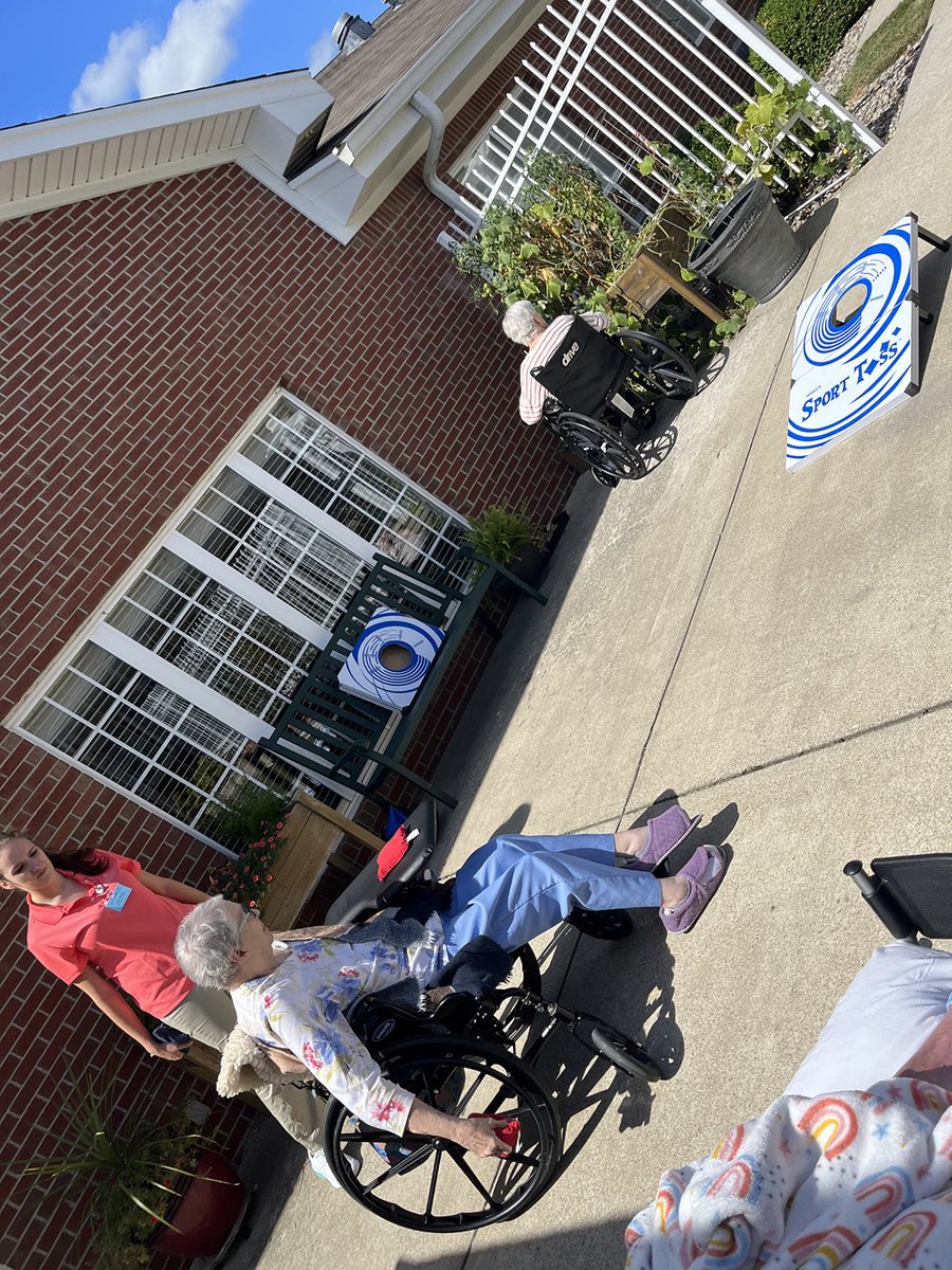 Residents enjoyed playing Corn hole out on the patio! #TrilogyLiving