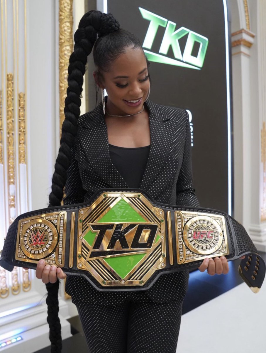 WrestleOps's tweet photo. Bianca Belair poses with the ‘TKO’ Championship to symbol the merger between WWE &amp; UFC today. https://t.co/yTsyJOSLJe