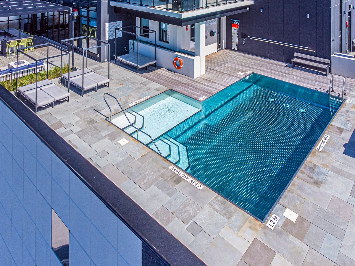 Elevating the view! Sometimes, ground-level views can't capture the full beauty of our condo architecture in Kitchener-Waterloo. Take a look at these stunning aerial shots of the Circa 1877 building and its incredible outdoor amenity spaces and pool.