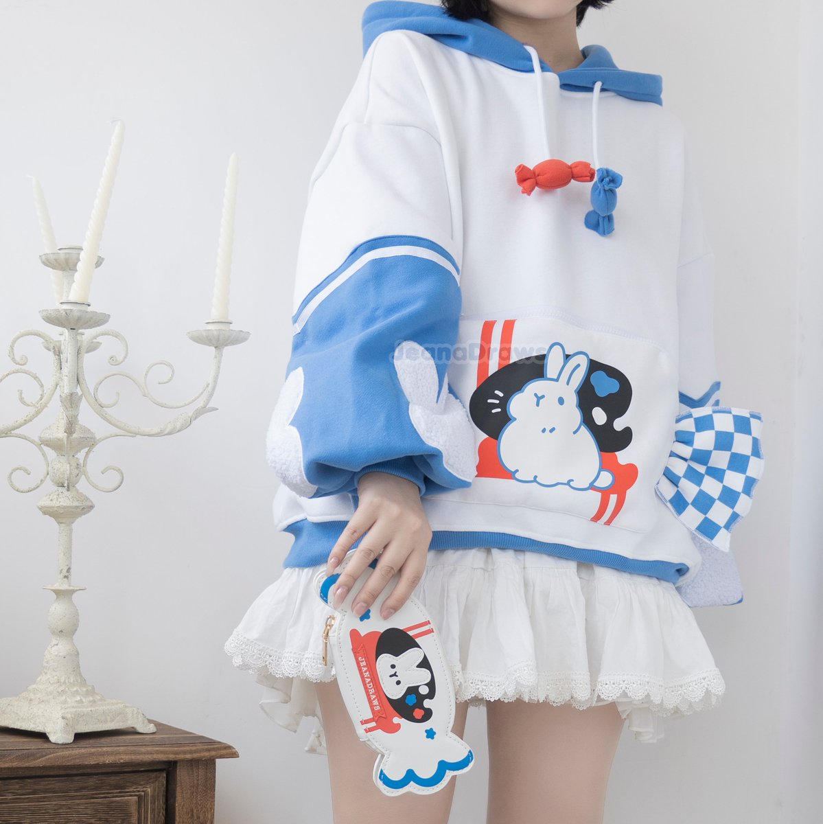 JeanaDraws's tweet photo. both white rabbit candy hoodie versions and the matching wallet and ita bag 🐰🍬 https://t.co/CGhYk2ZbED
