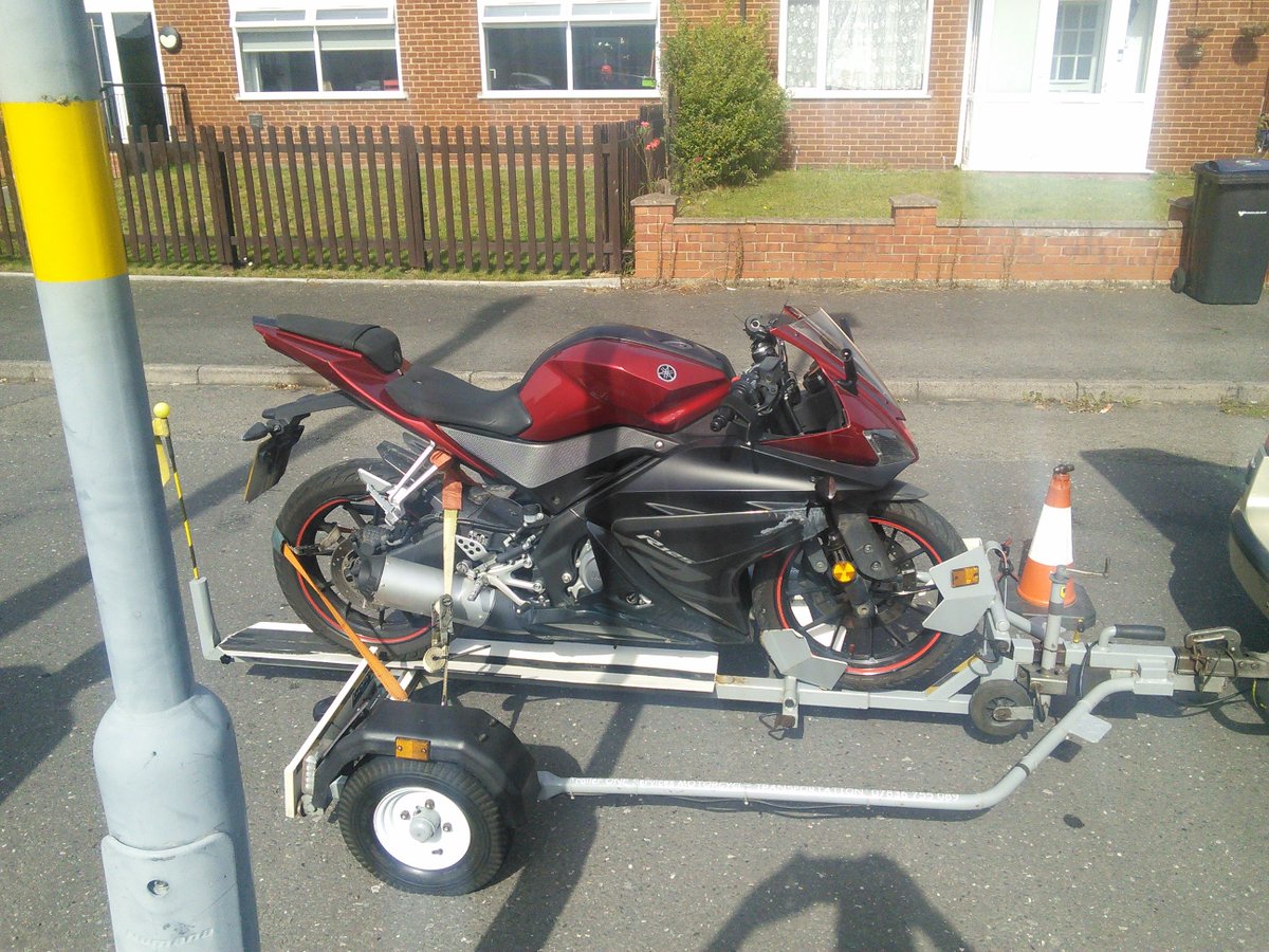 Trailer1one's tweet photo. Yamaha 125 YZF, resembles an example from the game Road Rash every single panel damage wheel an all, on its way to Sheldon Motorcycle for repairs quote unfortunately its beyond economical repair of the customer's budget, insurance claim it will be https://t.co/aV1cugjoyI