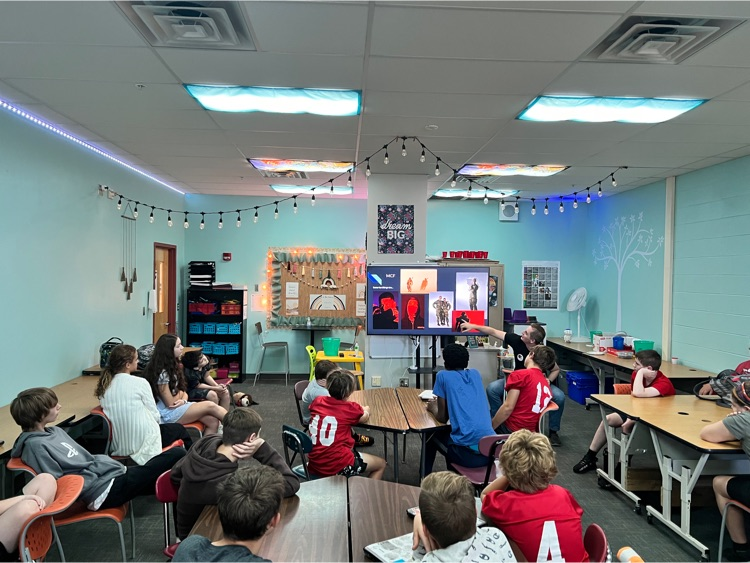 GoshenLocal's tweet photo. Students in Mrs. DeNu’s Career tech class had a special guest speaker today. Airman Thomas Hansford (who is a Goshen Grad) spoke about life in the Air Force as a Combat Photo Journalist for Public Affairs. It’s amazing to have graduates come back to speak about their careers! https://t.co/rRGozil11n