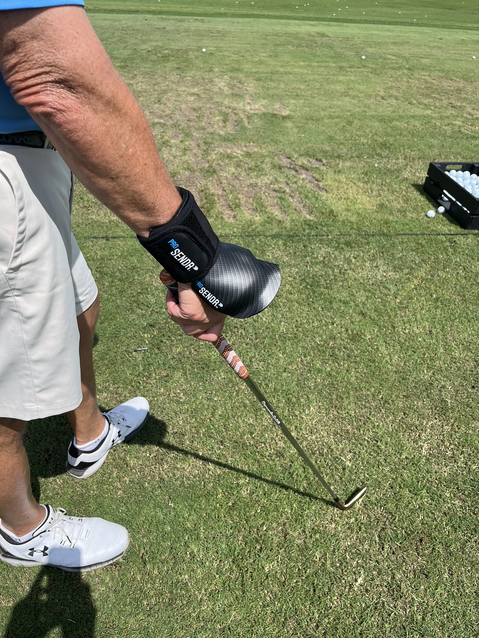Stock photo of a golfer practicing with training aids