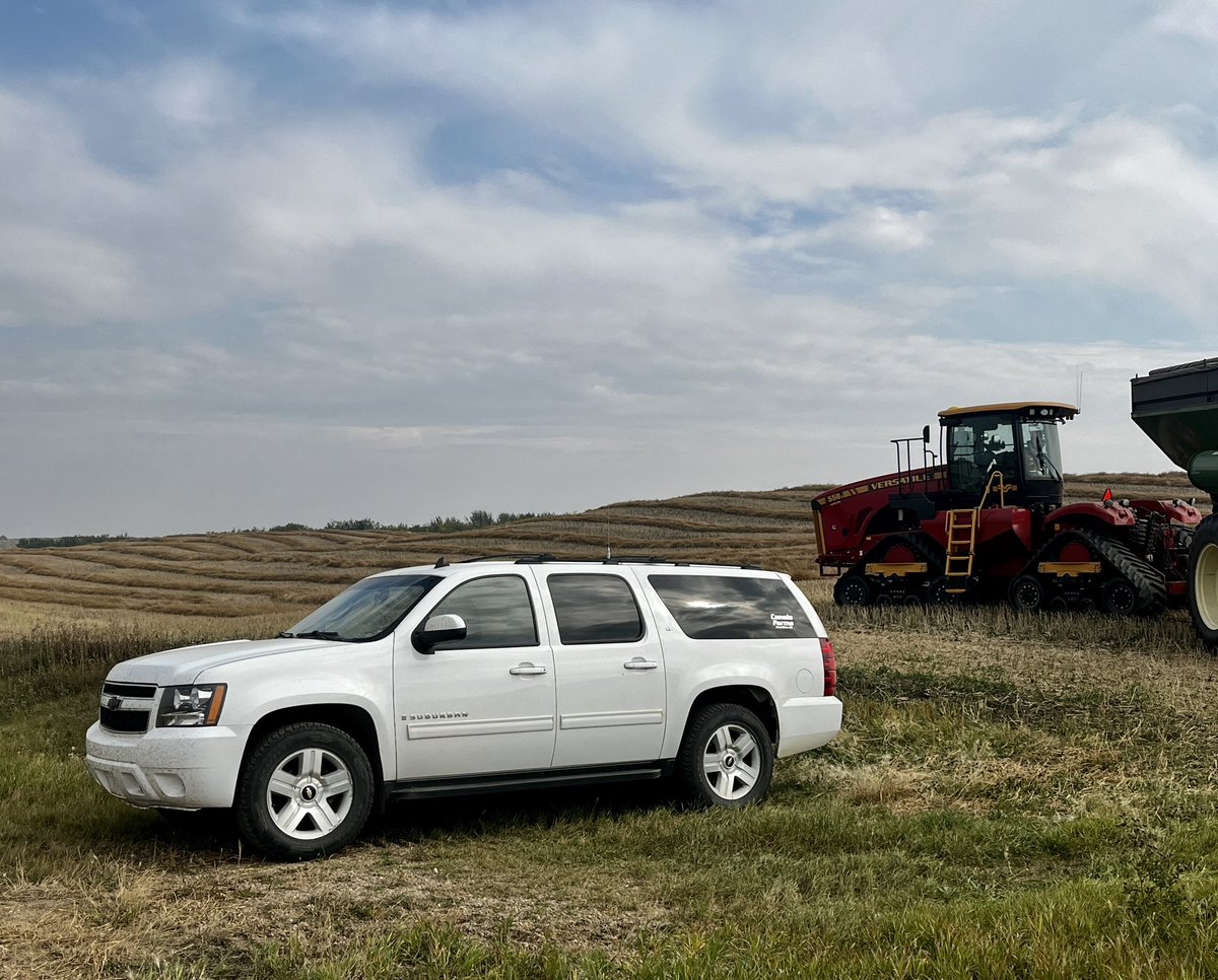 ShawnJacula's tweet photo. My farm wheels, a white Suburban with an antenna on top for my two-way radio, was parked at the approach off a secondary highway as we opened up the next field of canola. Sorry for all those who slammed on their brakes while coming over the hill. #notacop https://t.co/4NPkWBMzZE