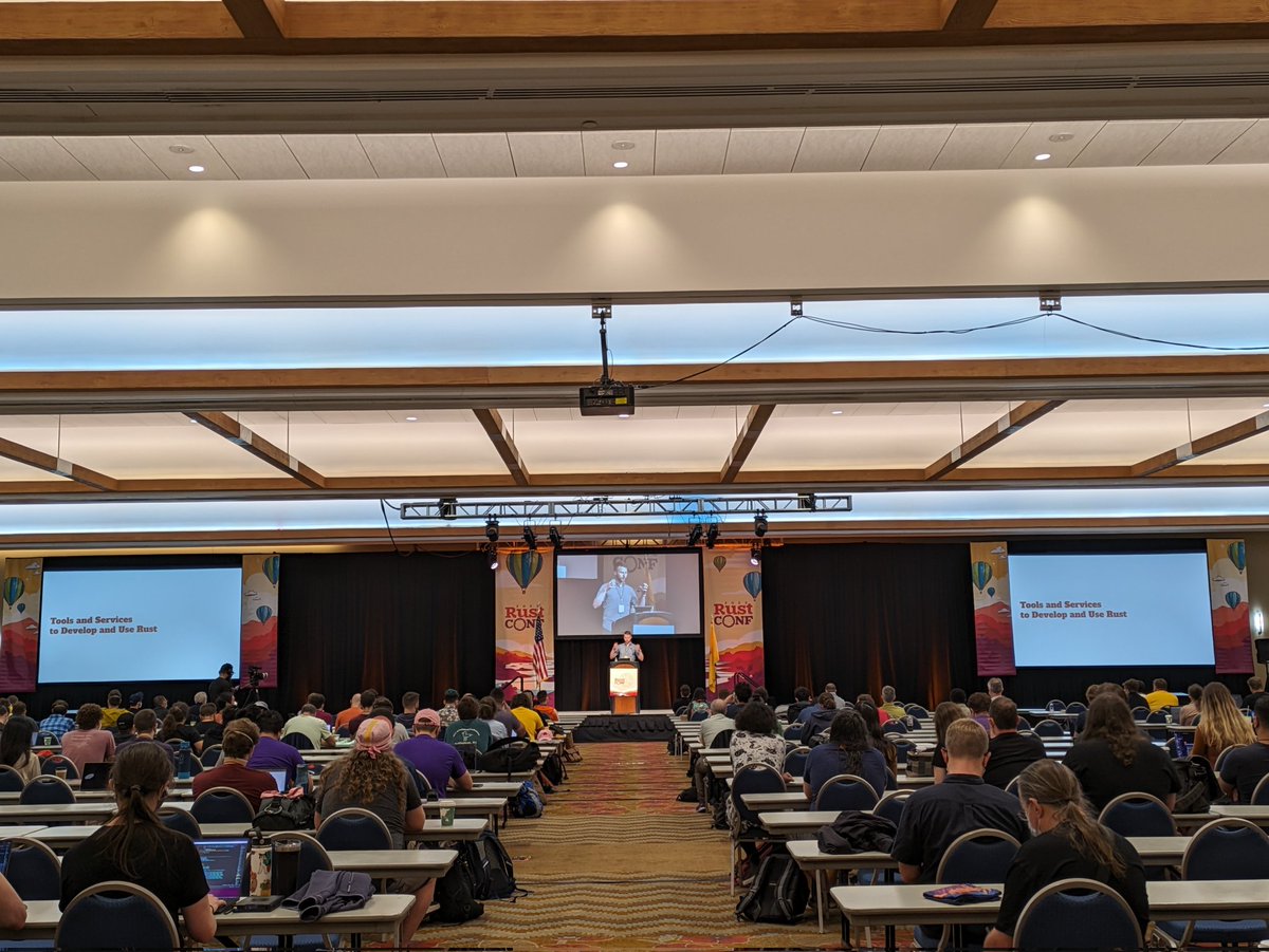 Packed room <a href="/rustconf/">RustConf</a> for the talk by our excellent <a href="/rust_foundation/">Rust Foundation</a> Infrastructure Engineer JD Nose!