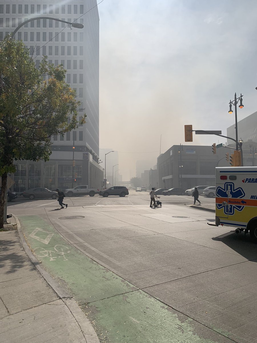 smjpilot's tweet photo. Smoke wafting in the air in downtown #Winnipeg. Apparently the Windsor Hotel is burning. https://t.co/P2nx1A6hVs