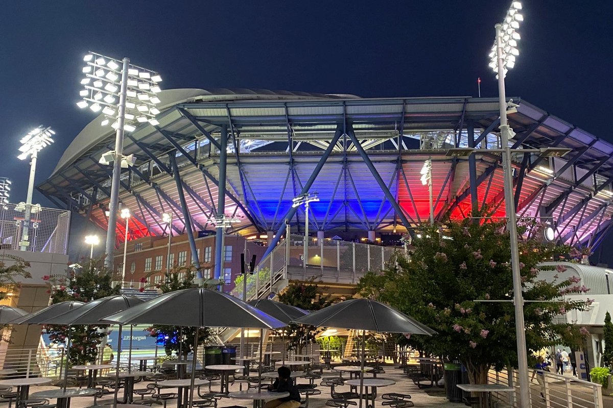 MuscoLighting's tweet photo. In addition to court lighting for the US Open, the Musco Team also served up this multi-colored custom facade lighting solution on Arthur Ashe Stadium’s eight-sided exterior. Sales Executive Don Rhuda snapped this photo when the system went online in 2021. https://t.co/6REEgzqE9y