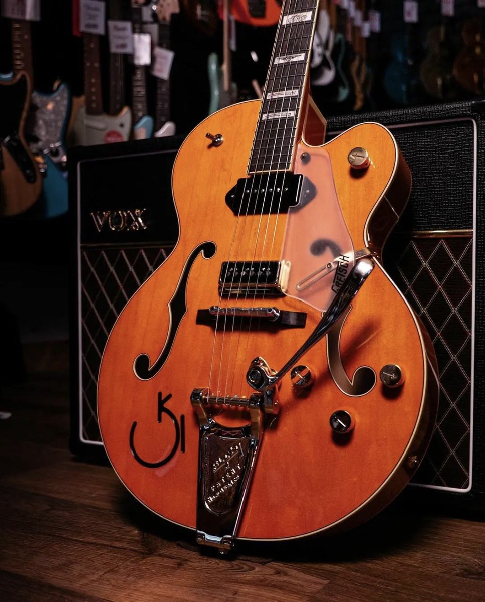 GretschGear's tweet photo. That bold #Gretsch sound! This iconic orange beauty represents 140 years of distinctive style &amp; innovation. Now rep your #Gretsch pride offstage with our exclusive merch at https://t.co/cPfpUNVWfM. Join the @Gretsch family - reply with your favorite model! 🎸 #GretschGear https://t.co/e7kpBY6YyF