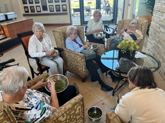 Wabash_WB's tweet photo. These ladies wanted to snap green beans, so we found green beans for them to snap. The stories and laughter that are shared during green mean snapping are priceless. Stories of their mothers, grandmothers, kids and grandkids were abundant! What a fun way to spend an afternoon. https://t.co/qXxVpEek6T