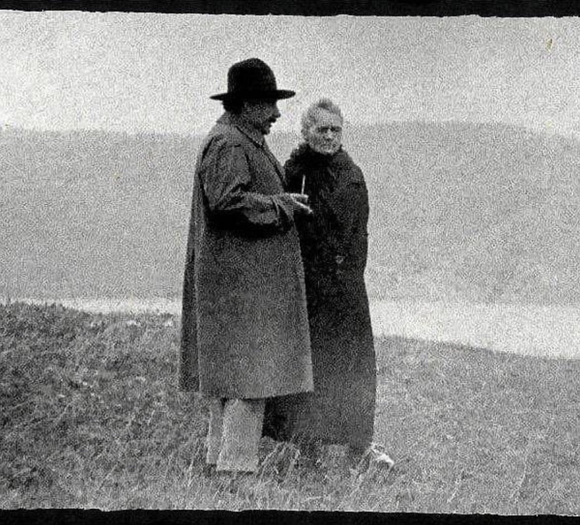 Albert Einstein and Marie Sklodowska Curie reminiscing by a lake in 1929. Back in 1906, Curie had lost her husband Pierre when he was killed by a horse-drawn cart while crossing a busy street in Paris. She mourned his death for a few years before finding comfort in Pierre's