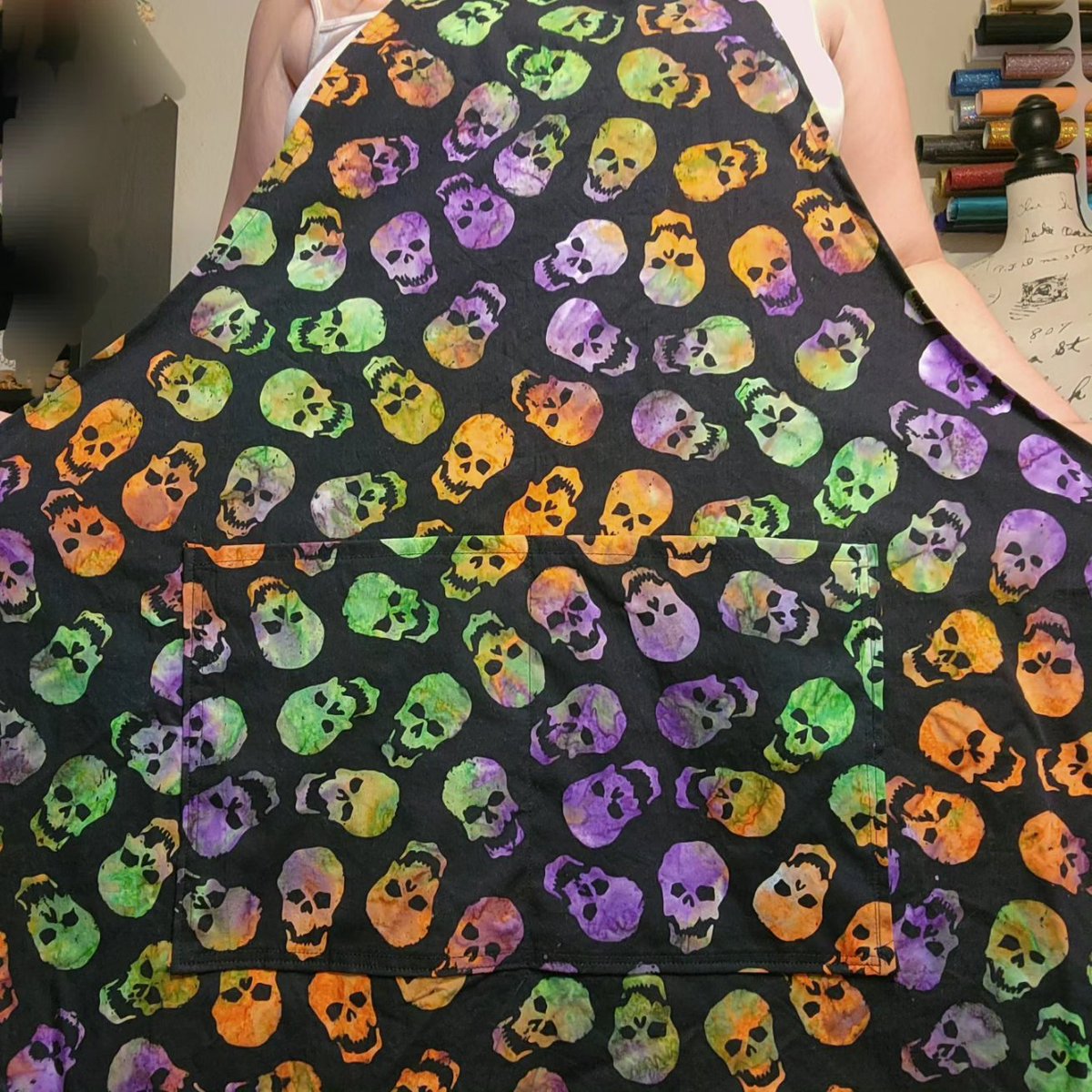 LOOKY HERE ALL! 
NEW SPOOKY APRON BY MEEEEE.

These colorful skulls are ready for you! 

Get this apron in my shop. Link in bio.
And I have a 25% off sale of all my other aprons and a bunch of other stuff! 
Check it out!