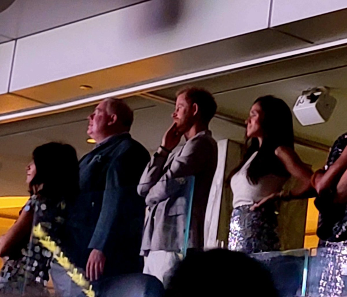 queen_meghan14's tweet photo. Meghan and Harry wearing matching silver outfits to Beyoncé’s concert is so iconic https://t.co/1843zA3fRM