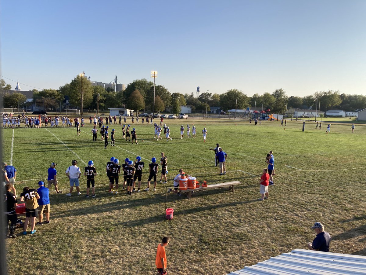 RevShevWLC's tweet photo. I’m up super early to catch a flight, but I can’t get this award-winning photo from a Friday night out of my head! Is there anything more America: 8-man football, (then from right to left) playground, water tower, grain elevator, steeple in a town of 250? #landthatIlove #NELHS https://t.co/nu7py5Zw1g