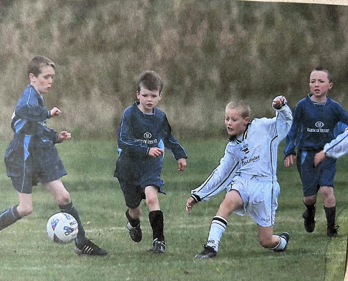 Eamdee's tweet photo. @CarryduffColts played it’s first ever competitive game this day 20 years ago, in the under-10 in South Belfast Youth League. Look at the concentration on @Pmccullagh140 face (far right)! @mdee1967 @coh_63 Celebrate our 20th anniversary on 16 September https://t.co/Dc9gbZQo2z https://t.co/0DhAxd12XR