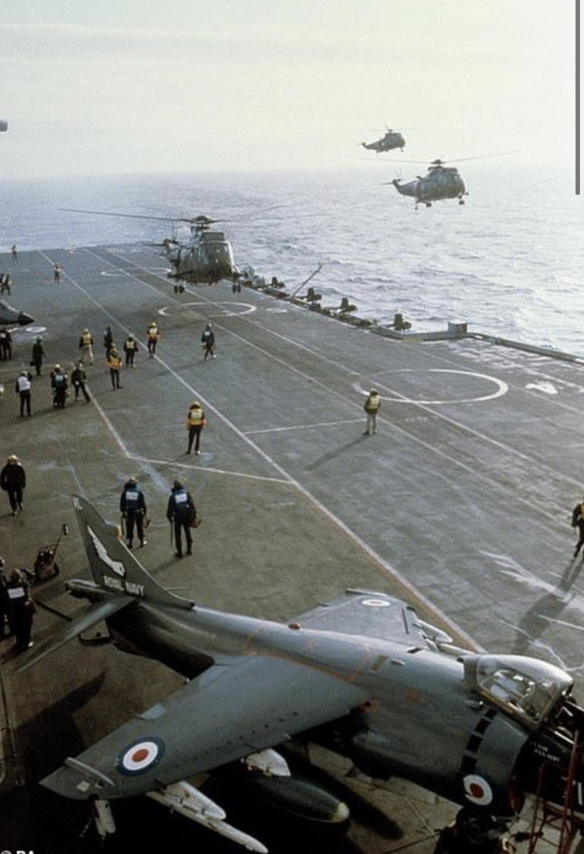 HarrierPres's tweet photo. The the deck of Hermes in 1982 on the way south. With an 899NAS FRS.1 clearly in the shot, and seakings in the recovery. #SeaharrierFRS1 #Harrierpres #899NAS https://t.co/2ZpA9chW7r