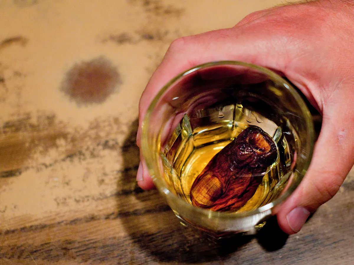 CraigBaird's tweet photo. It is one of the most famous drinks in Canada, but what is the story behind the Sourtoe Cocktail?

While the cocktail is relatively new, the legend behind it dates back a century. So, let's learn more about this Dawson City tradition!

According to legend, two brothers, Louie and Otto Linken, were caught in a blizzard in the early-1920s. The legend states they were rum-runners and were doing a cross-border delivery. On the fateful night, they were fleeing from police.
To help direct his dog team, Louie stepped off the sled and his foot went into the icy water.

By the time the brothers returned to their cabin, Louie's foot was frozen solid. To prevent it from going gangrene, Otto chopped off Louie's toe with an axe and put the toe in a jar of alcohol.

Fast forward 50 years and Captain Dick Stevenson found the jar and toe in a cabin. At that point, he decided to create the Sourtoe Cocktail Club. To join, one just has to drink a cocktail, costing $5, and their lips must touch the toe as they drink. 

The instructions are:
"You can drink it fast, you can drink it slow, but your lips must touch the toe."

The first toe lasted seven years before it was accidently swallowed by a man on his 13th glass of the Sourtoe cocktail who fell backwards.

In 2013, Joshua Clark, a writer from New Orleans, swallowed the toe on purpose. He was fined $500 and soon found a group of angry bartenders and town residents looking for him. He quickly slipped out of town. He was banned from the Downtown Hotel. Clark returned three years later to apologize. 

Various toes have also been stolen by customers, hoping for a memento from their experience. Today, stealing the toe carries a $2,500 fine.

To date, 100,000 people have drank the sourtoe cocktail. Many toes have been used, 25 in total, that have been donated for the purpose of being in the sourtoe cocktail. Three toes were donated by Nick Griffiths, an endurance athlete who lost his toes to frostbite. Another toe arrived in a jar with a note that warned about mowing the lawn in open-toe sandals. 

To be used in the cocktail, the toes are cured in salt for six months. 

In 2019, the man who created the sourtoe cocktail, Dick Stevenson, died. In his will, he requested all 10 of his toes be donated for use in the sourtoe cocktail. His ashes were also put in a toe-shaped urn. 

If you enjoy my Canadian history content, please consider a donation to Canadian History Ehx at https://t.co/u12Dmz8vKv

Sources:
https://t.co/Guzuhee5Mm
https://t.co/0cCrMHKWqy