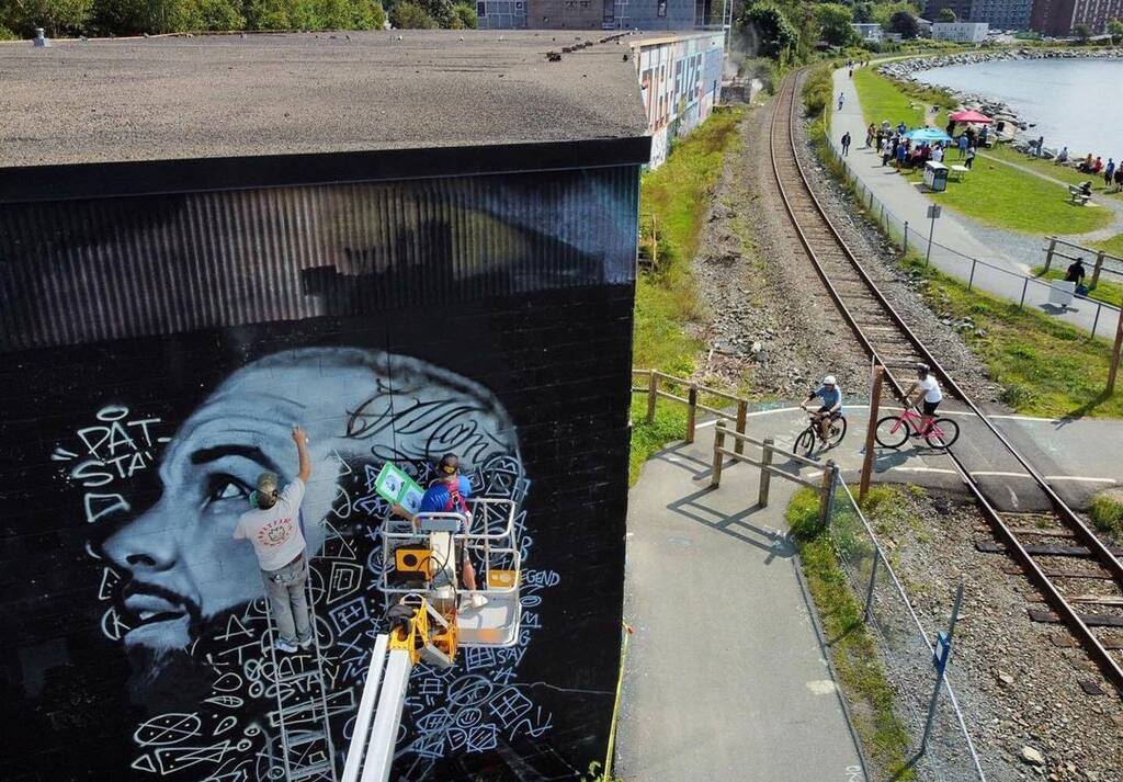 halifaxnoise's tweet photo. From @timbophoto —
@bunhundred and @princefuze work on a mural memorializing late local battle rapper Pat Stay, who was murdered Sept 4 last year and will be marked with a Pat Stay Day event this afternoon in #dartmouth #novascotia #canada #902 #roamwith… https://t.co/jAqAII6Mm2 https://t.co/3qXJfsD3ru