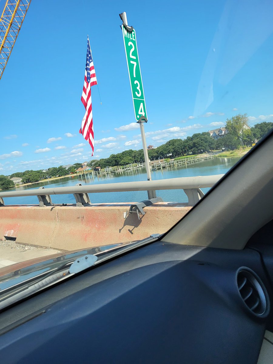 Huge American flag flown from a crane, seen headed west this morning to Hampton on the HRBT
