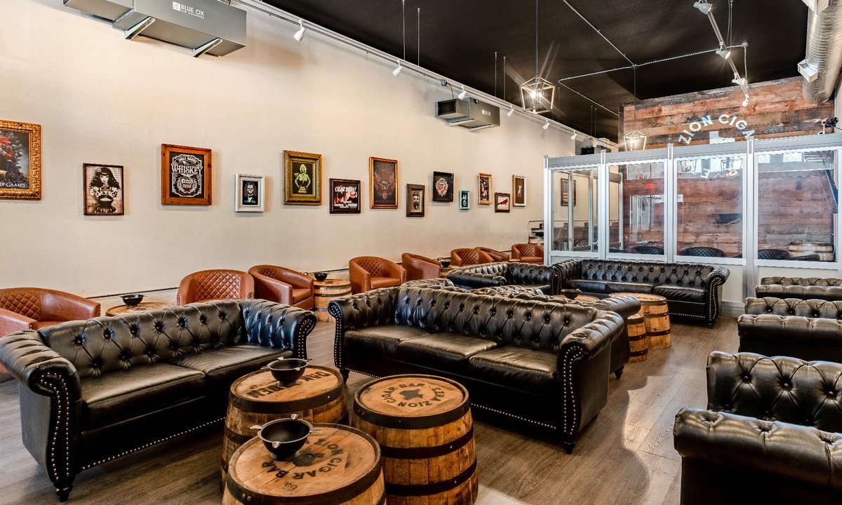 EzraZionCigars's tweet photo. Ladies and Gentlemen. Boys and Girls. Cigar smokers across the fruited plain…

We are extremely excited to announce to you the opening of the EZRA ZION CIGAR BAR! 

*Doors open for the very first time at 10am on SEPTEMBER 5, 2023!

We’ve been to hundreds of cigar shops, bars, and lounges the world over. After all these years, we wanted a place that we could call home.
 
But we had to do it the “Ezra” way!

Instead of boring you with a dull press release…here’s some thoughts and insights from us about all this:

Chris Kelly: “EZHQ has been located in Wise County, Texas since our inception. It was important to us to have our flagship EZRA ZION CIGAR BAR located here in this area that has been so good to us.”

Kyle Hoover: “We love vintage. Anyone who knows our tobacco philosophy knows that. When we had the opportunity to build the EZRA ZION CIGAR BAR on the iconic Decatur Square in the historic Empire Drug building, we jumped at the chance”

Chris Kelly: “We wanted to make the ultimate place to smoke. Phenomenal cigars and a full line-up of our favorite bourbons, scotches, beers, and cocktails to pair with them.”

Kyle Hoover: “The decor is epic. Leather seats, a VIP room, Oak & Eden whiskey barrels for tables, and some of our favorite cigar art from our past releases. Add the impeccable multi-layered, state-of-the-art air filtration system and you have a cigar smoking experience like no other.”

Chris Kelly: “We pulled out all the stops for the EZRA ZION CIGAR BAR. We spared absolutely no expense. I don’t know how we could make it any cooler. We left it all on the field to make the best possible cigar bar we could do.”

Kyle Hoover: “EZRA ZION CIGAR BAR is classy but not fancy. A mix of eclectic with nostalgic, cutting-edge modern with a big does of vintage. It’s all about finding that balance—just like blending a cigar—that makes it perfect.”

EZRA ZION CIGAR BAR is located at 103b W. Main St., Decatur, Texas 76234. Hours will be from 10am-9pm Mon-Thurs, 10am-10pm Fri-Sat, 12pm-6pm on Sun.