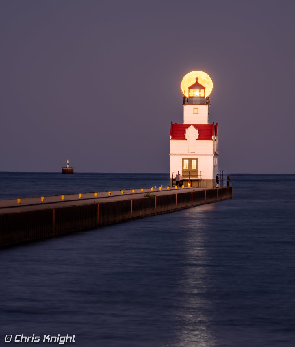 Super Sun vs. Super Moon rising over Lake Michigan this week at the Kewaunee Pierhead Light, Wisconsin. Images captured an hour apart. Sunset photo is not rare but the Super Blue Moon won't return until January 2037.