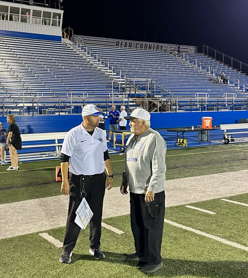 Two Coach Planz's talking ball after a great win Friday night!