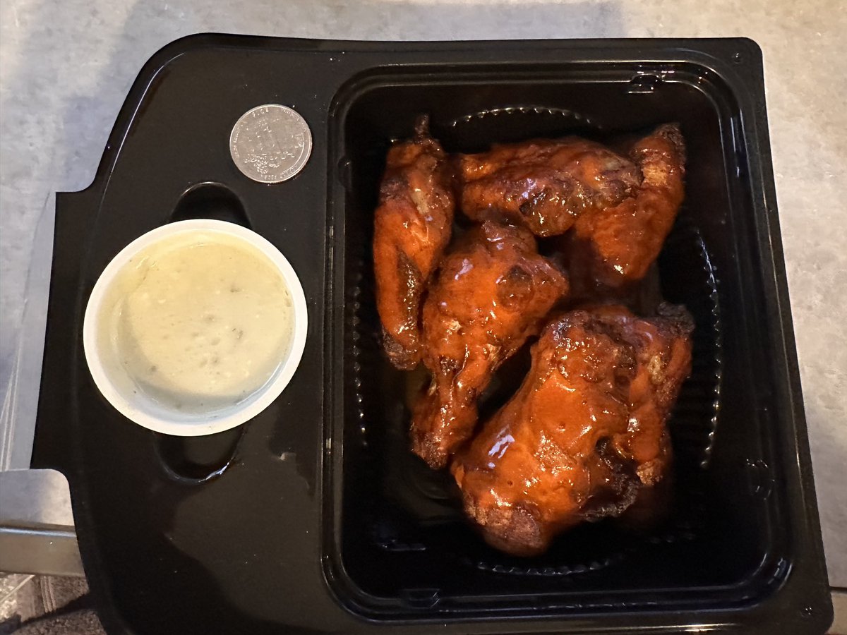 OCMikeFleming's tweet photo. @PapaJohns Very disappointed. Haven’t ordered in years. Ordered pizza and wings. 6 Wings were $12 + tax and tip. They are pitifully small! Pigeon wings? I placed a quarter for size reference. $2.00+ per wing for these is a rip off. #PapaJohns https://t.co/u2VpmbcaeH