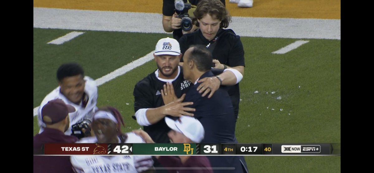 That’s Kelly Damphousse on the field with Kinne after the win