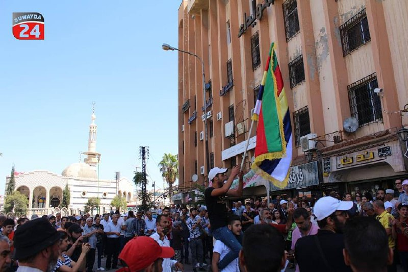 RevolutionSYR23's tweet photo. The demands of the protesters in As-Suwayda are clear: the imperative departure of Assad, and the enforcement of international resolution 2254. #RevolutionForAllSyrians #ثورة_لكل_السوريين https://t.co/mE8EWTWipd
