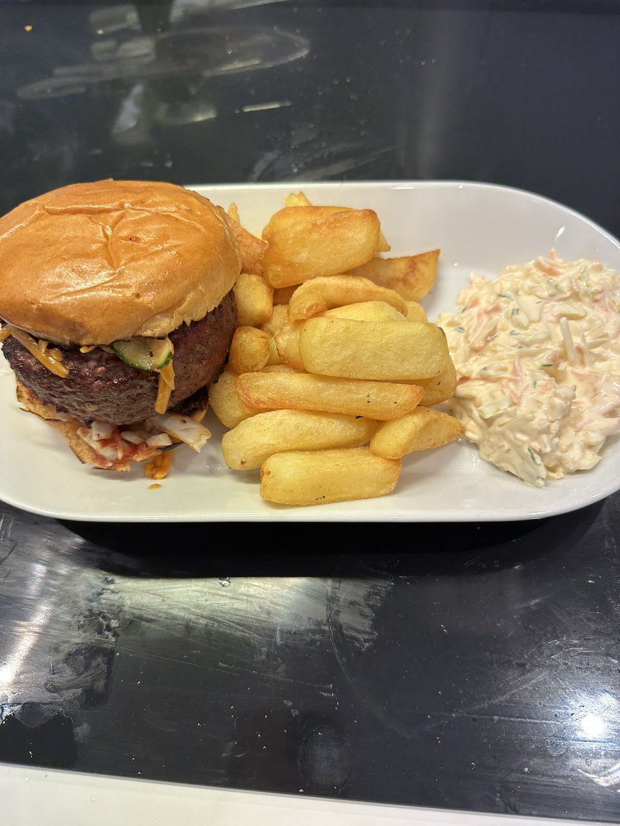 milesSI's tweet image. Homemade beef burger, stuffed with Worcestershire sauce soaked Red Leicester cheese (which oozes out when I bite into it) with homemade pickled cucumbers &amp;amp; pickled cabbage, served with triple cooked chips and coleslaw.
#nomnomnom