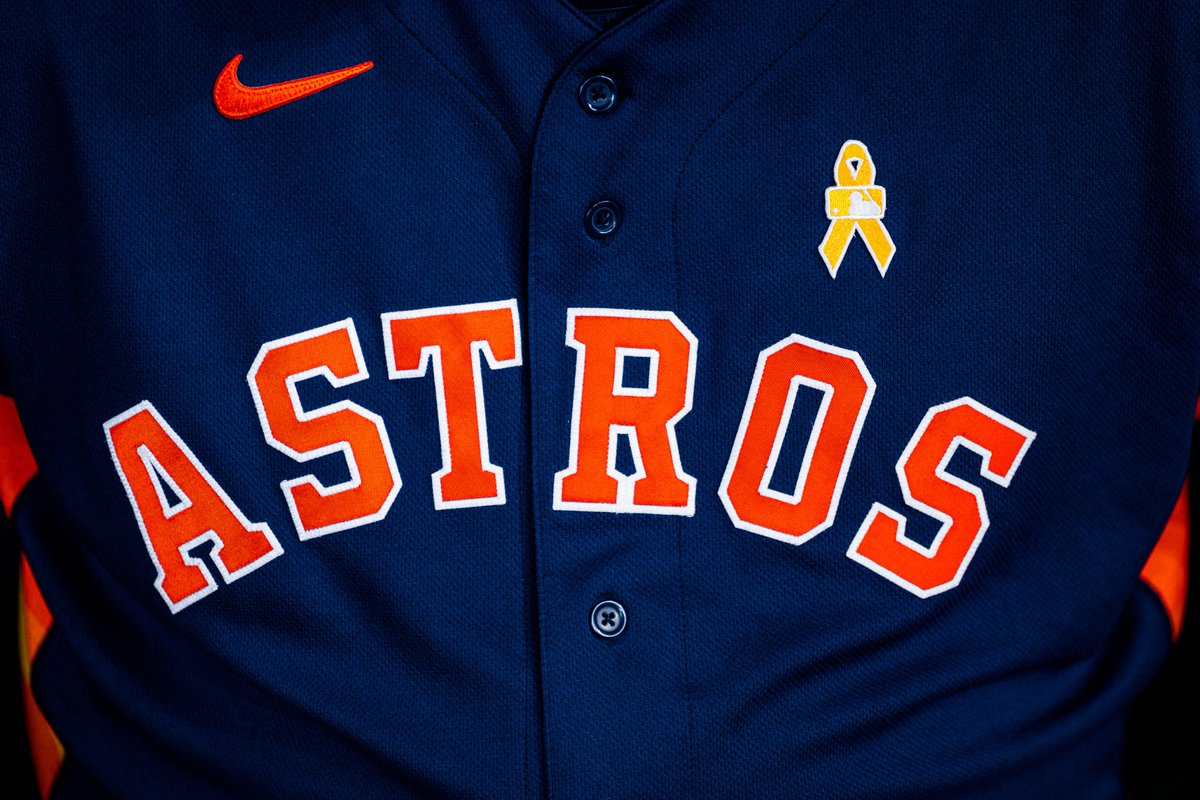 Why are Astros and Yankees wearing gold ribbons and wristbands?