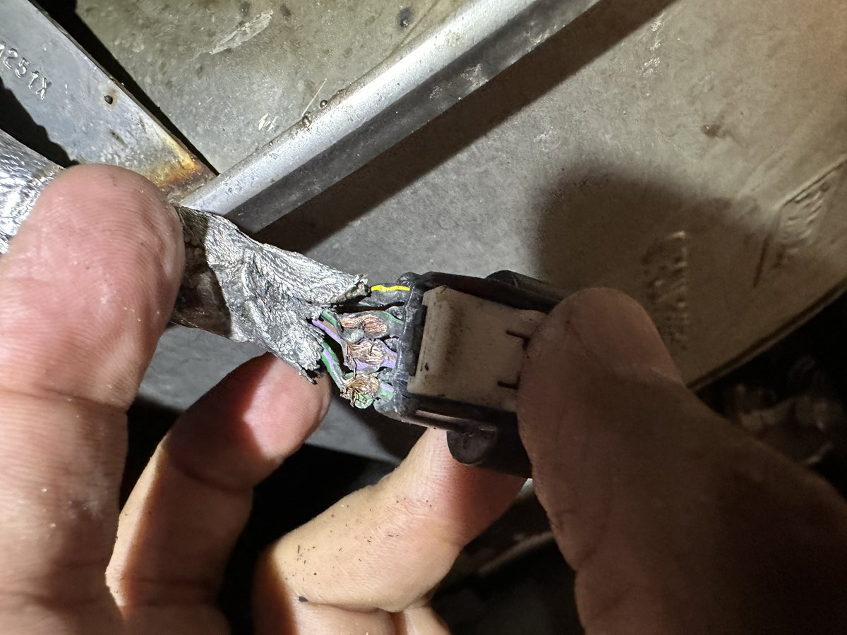 SpinAllFour's tweet photo. Active exhaust wiring harness the engineers at @Ford thought would be cool sitting next to an edge on the body of the car…C’mon man!! 🤬 car has 1500 miles on it! https://t.co/xZsYSgPXMV