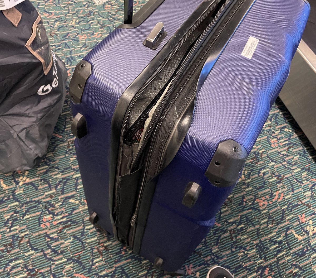 dasootas's tweet photo. Really? @FlyFrontier . Flown the world with this @HeysLuggage bag and all it took was a two hour domestic flight for you to tear my bag apart. https://t.co/9v2tDZge07