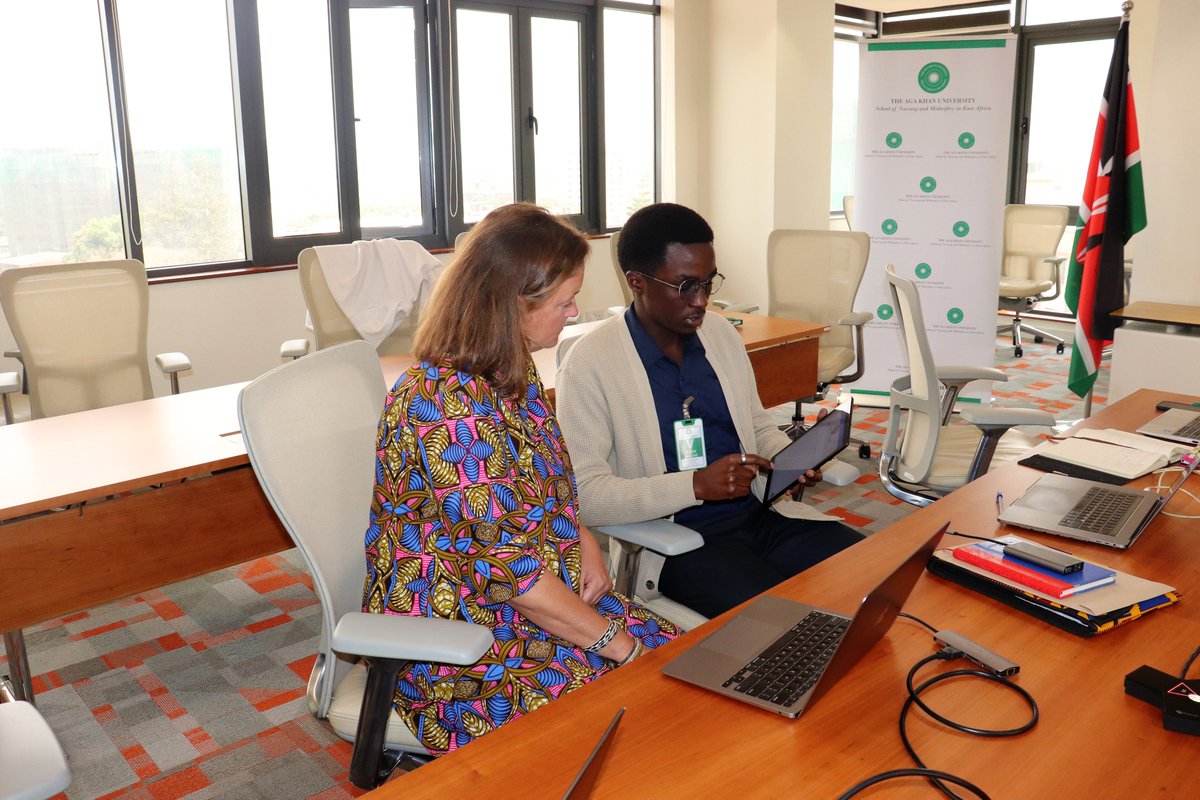 NursesMidwife's tweet photo. A software programmer from @mHealth_Kenya demonstrates the various capabilities of the #KeNum app to Stacey Meyers, the Global Community Impact Leader-EMEA @JNJGlobalHealth. https://t.co/3Xh5e2cWmv