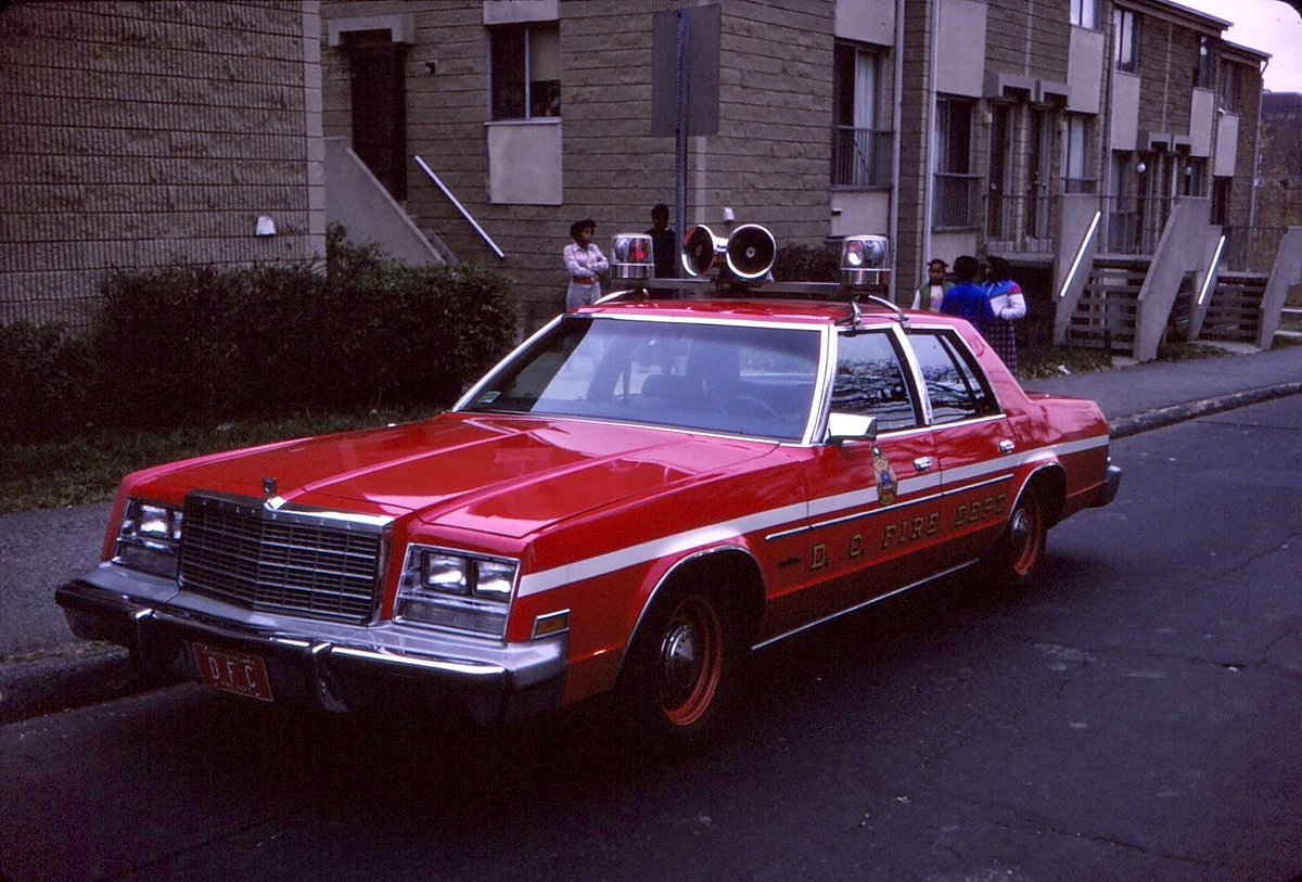 DCFDKelleher's tweet photo. “Carry the Firefighting Deputy on Box Alarm 263” - The @dcfireems Deputy Fire Chief of the Firefighting Division on the scene of a #fire in the Sursum Corda neighborhood (NW #DC) during the 1980’s. #DCFD #DCFDHistory https://t.co/LWo7OYIct5