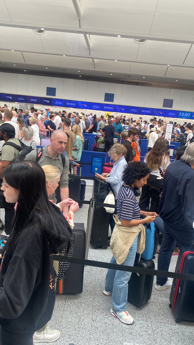 Standing at <a href="/Gatwick_Airport/">London Gatwick LGW</a> in the <a href="/British_Airways/">British Airways</a> queue. Have been here for 45 minutes so far. And I’m still this far back. No one is updating us why it happened. It’s hot and sweaty. Everyone’s feeling dizzy. Noone can leave the queue to buy water. Worst airport experience!