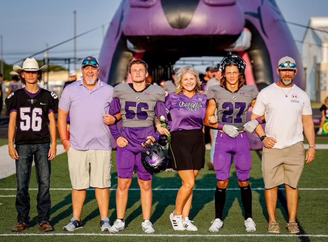 Getting this photo made my day!! 💜🏈🖤 It takes a village! And these three young men, have a BIG village behind them that love and support them! We love them beyond words!! #seniornight #DaDirtyF @LaytonBrian @ConnerDwight1 @Dakotalayton6 @MaddoxDwight12