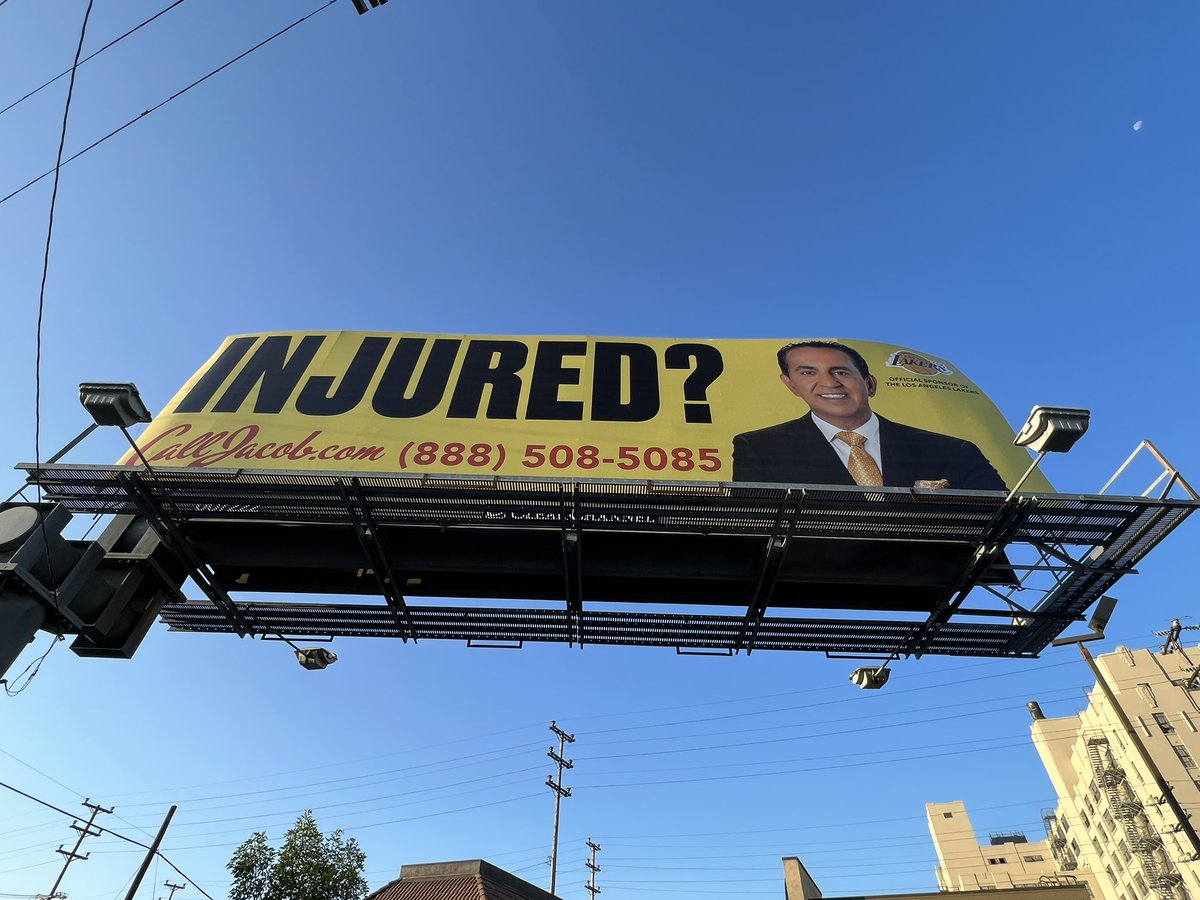 SaulGonzalezCA's tweet photo. Two sides of the same billboard. Everlasting life or litigation? https://t.co/9gP2Jcel8g