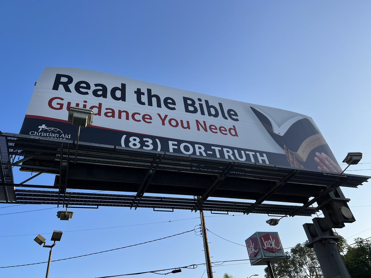 SaulGonzalezCA's tweet photo. Two sides of the same billboard. Everlasting life or litigation? https://t.co/9gP2Jcel8g