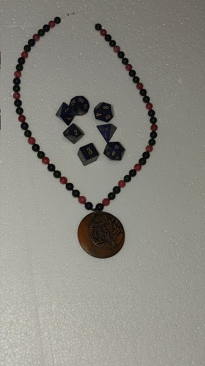 aletamosquito's tweet photo. Here is my lapis lazuli dice set from @urwizards along with a necklace I made using rhodochrosite, jade, and lapis lazuli beads. Lazurite, the blue mineral in the lapis is a member of the #sodalite group. #MinCup23 https://t.co/HGZMTE3XrE