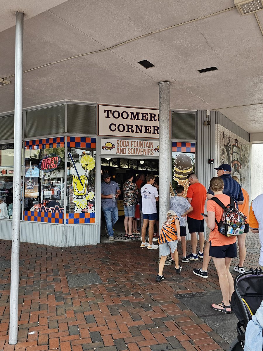 Toomers Corner at the Corner of Auburn University and downtown Auburn. They sell fresh, squeezed lemonade that is a must to taste and quench your thirst. Fans meet up here after a win and roll (tp) the oak trees behind me.