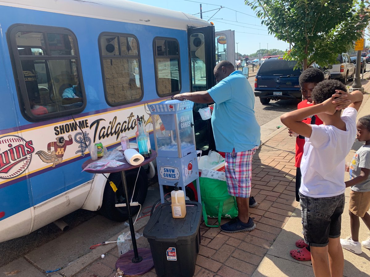 FrederickMelo's tweet photo. Milan Dennie opened a barbershop on University Avenue that does an annual free back-to-school haircut day today. And free backpacks. And he started a youth chess club. And this summer he started a youth-run Polish sausage truck. And today a free bounce house. https://t.co/XeBJBq4FGl