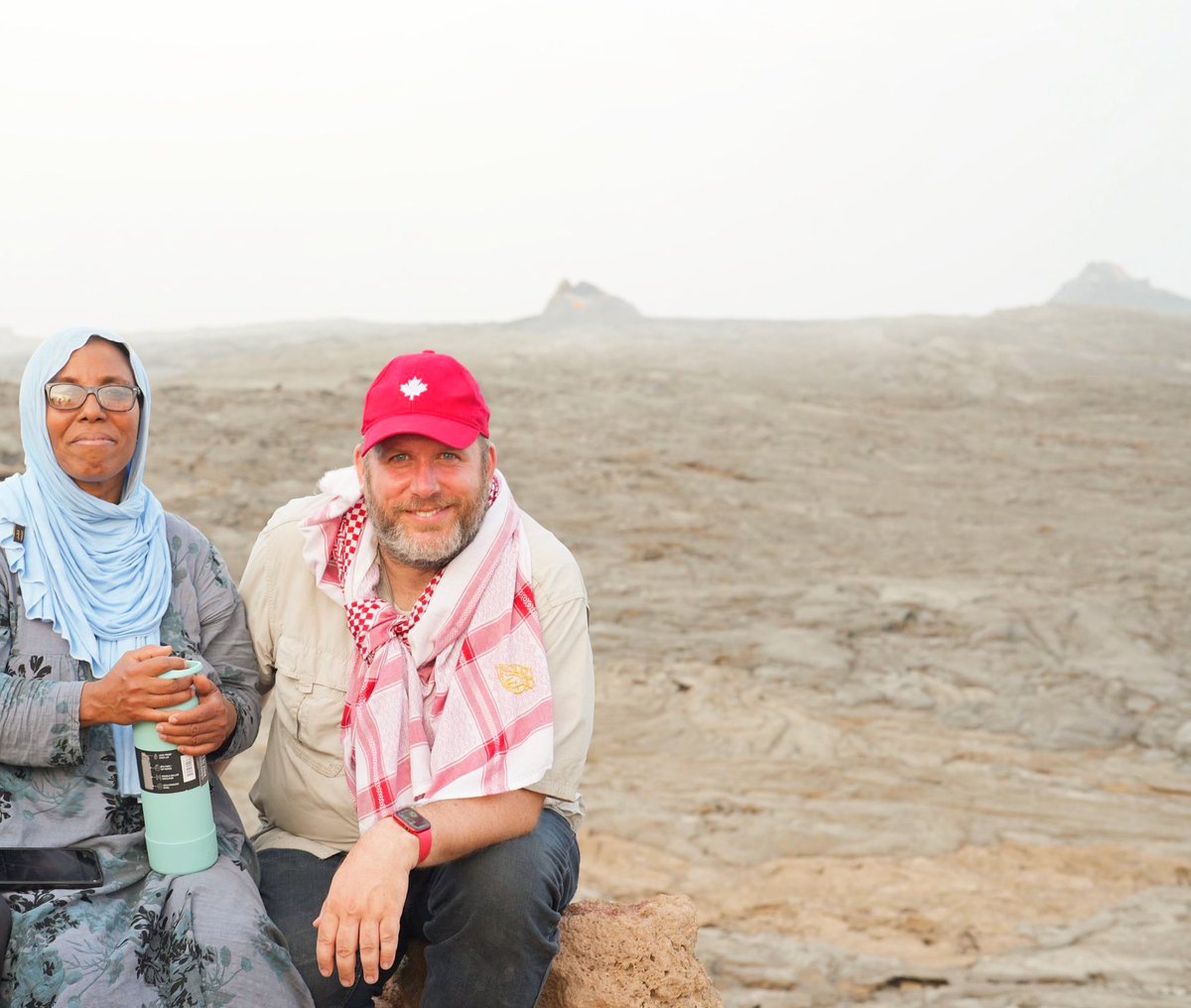 CanGoAfar's tweet photo. Mission 13 leads Aicha Youssef and @JasonKellyOtt pose at the edge of Erta Ale volcano in northern Afar. 
The most active volcano in Ethiopia, Erta Ale has been erupting continuously since 1967 and is home to two lava lakes. It’s also one of the biggest tourist draws in Afar. https://t.co/yKv2t66qaZ