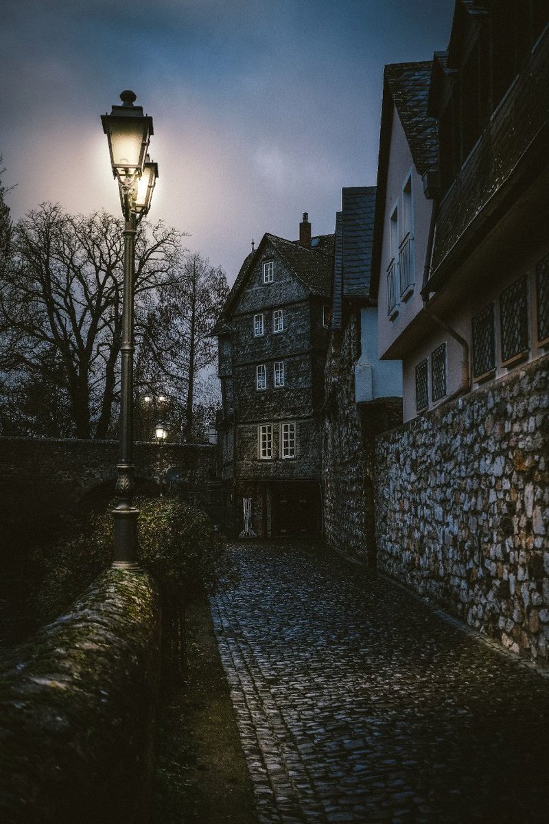 Dark nights and cobblestone pathways.