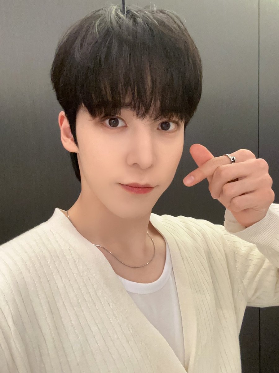 Returning to share some recent images of myself, donning a transformation with dark locks gracefully framing my visage, complemented by the timeless elegance of a white shirt. The combination undeniably exudes a striking sense of style, which I hope you find as appealing as I do.