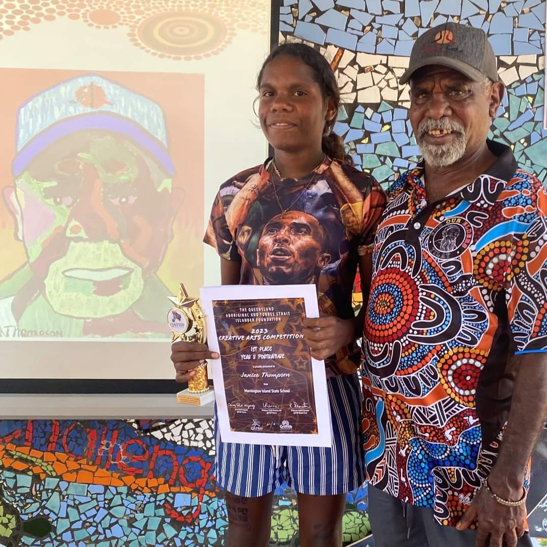 QATSIF's tweet image. Congratulations to the very talented Janice Thompson from Mornington Island State School who received her 1st Place Trophy in the Year 8 Portraiture section of our 2023 QATSIF Creative Arts Competition.

Janice pictured with Pa Johnny.

Too deadly Janice. Keep up the great work!