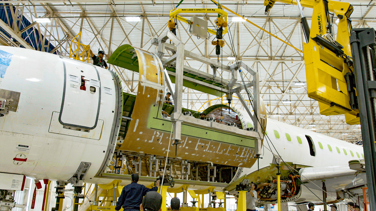 embraer's tweet image. Take a look at our new door frame on the first #E190 passenger-to-freighter conversion. Our P2F E-Jet conversion program is progressing smoothly, right on schedule. #WeAreEmbraer #EmbraerStories #Freighter #cargo #EJets #HighTech #VeryHuman